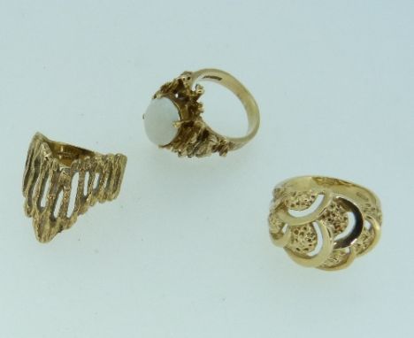 Three 9ct yellow gold Rings, one with V shaped pierced and textured front, one set oval white opal in elaborate textured moun