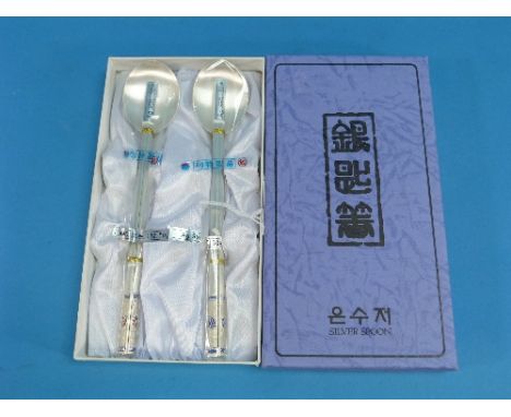 A pair of 20th century Chinese silver Spoon and Chopstick sets, marked AG990, comprising two spoons and two pairs of chopstic