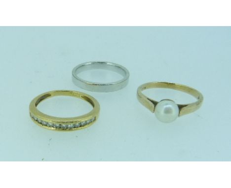 A 9ct white gold Wedding Band, 2.5g, together with a 9ct yellow gold ring, set with cultured pearl, and an unmarked yellow me