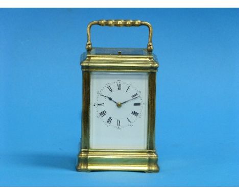 A French gilt brass striking Carriage Clock, of five-glass form, with white enamel dial and black Roman numerals marking the 