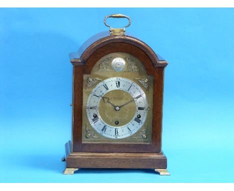 A 20th century walnut cased Elliott 8-day Westminster and Whittington Chime Bracket Clock, of arched form with handle and wal