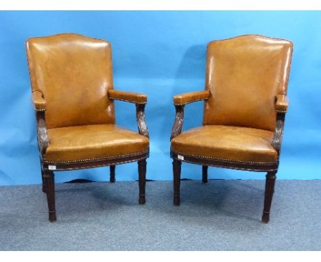 A pair of 19thC Hepplewhite style mahogany Armchairs, the seats, back and arms upholstered in fine light brown hide, with car