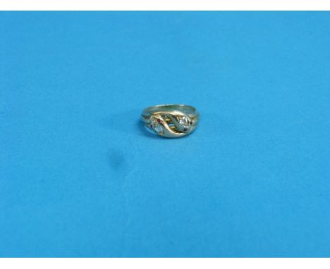 A double headed snake Ring, in the Victorian style in the form of two interlocking snakes, the heads each set single diamond 