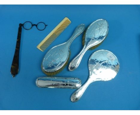 An Edwardian silver mounted Dressing Table Set, by Colen Hewer Cheshire, hallmarked Chester 1907, comprising two hair brushes