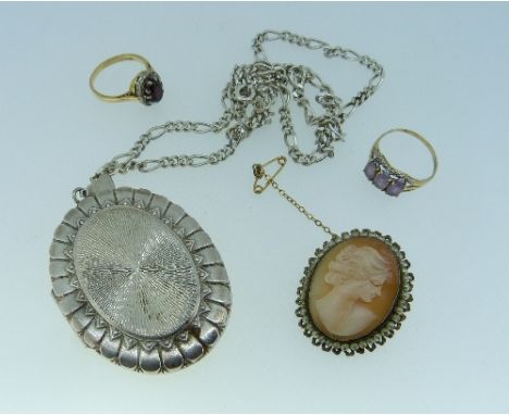 A small collection of Jewellery, including two rings, one set garnet surrounded by small diamond points, mounted in 18ct yell