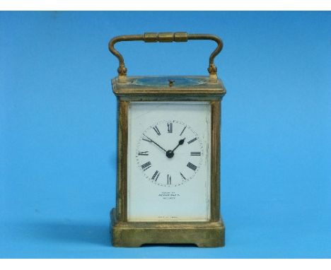A French gilt brass repeating Carriage Clock, of five glass form with white enamel dial and black Roman numerals, signed Exam