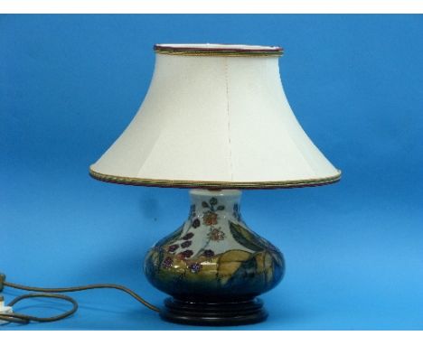 A Moorcroft pottery 'Blackberry' pattern table Lamp, of squat vase form with shade and wood stand, lamp base 6in (15.25cm) hi