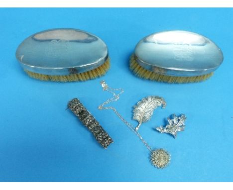 A pair of silver backed oval Hairbrushes, by William Comyns, hallmarked London, 1903, monogrammed, together with a silver and