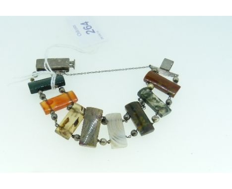 A Scottish agate link Bracelet, formed of eight rectangular link in various agates including browns, whites, green etc., with