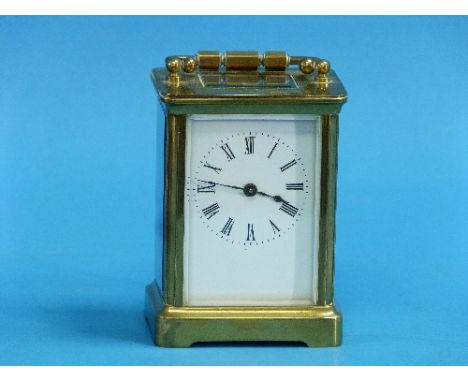 A French gilt-brass Carriage Clock, of traditional five-glass form, the white dial with Roman numerals, 5½in (14cm) high hand