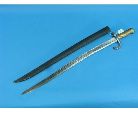 A French Franco-Prussian War period Bayonet and scabbard, circa 1870, the saber-style bayonet with 22½in (57cm) blade and bra