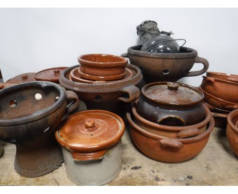 Two boxes of terracotta pots and bowls and an oil lamp 