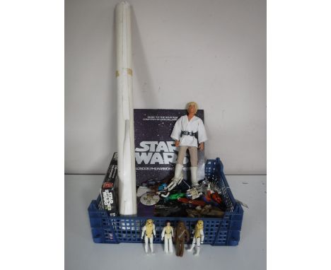A basket of assorted Star Wars figures and collectables including a 12 '' Luke Sky Walker doll, vintage figures Hans Solo, Da