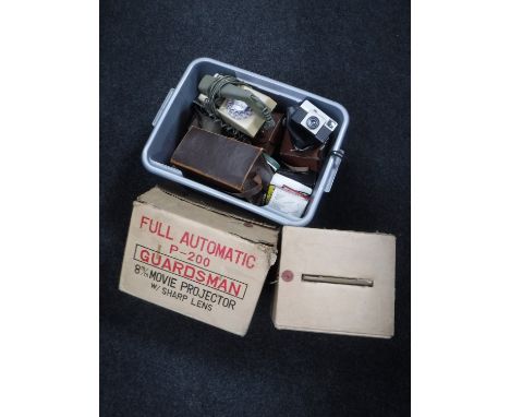 A box of Bakelite telephone, assorted cameras and accessories, movie projector and screen 