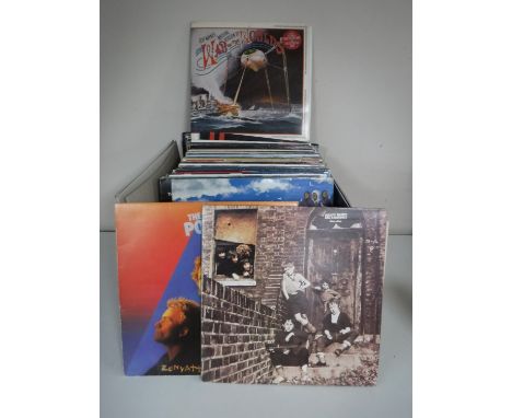 A box containing a quantity of LP's, Rock and 1980's including The Who, Rolling Stones, Gary Newman, Queen, Michael Jackson e