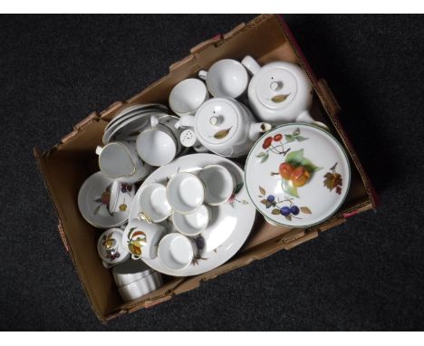 A box containing Royal Worcester Evesham china and oven ware
