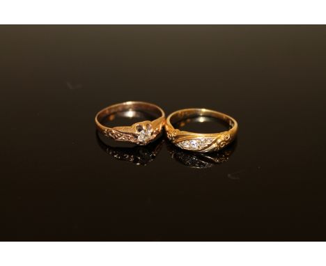 An 18ct gold five stone diamond ring, together with a diamond solitaire ring