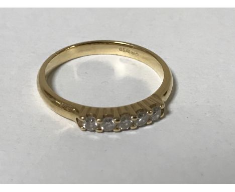 An 18ct gold five stone diamond ring, approximately 0.25ct, size N, 3g.