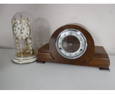 A walnut cased mantel clock and a Kundo anniversary clock under shade 