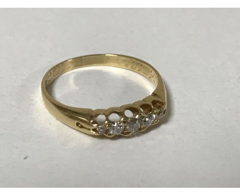 An 18ct gold five stone diamond ring, size O, 2.7g.