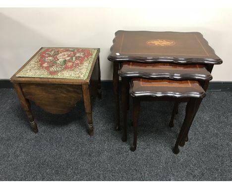 A nest of three inlaid mahogany tables and a commode 