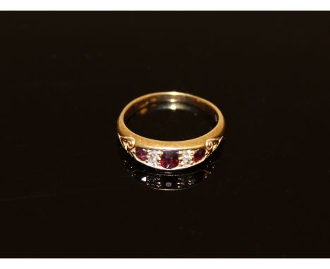 A ruby and diamond ring CONDITION REPORT: The ring is in good condition. Size N. 4.2g. The hallmark is rubbed. The central ru