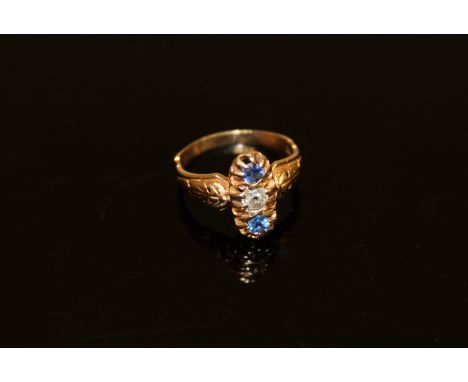 An 18ct gold sapphire and diamond three stone ring