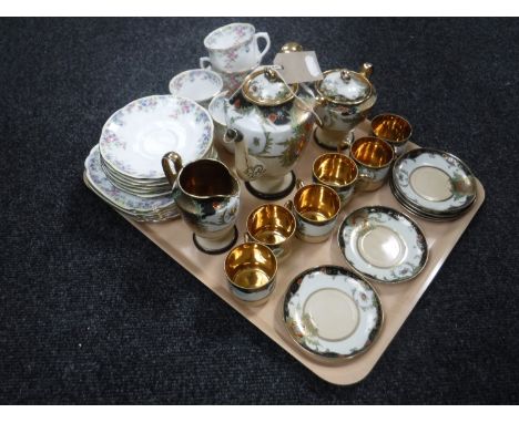 A tray containing a fifteen-piece Oriental style gilded tea service together with seventeen pieces of Crown China Maytime tea