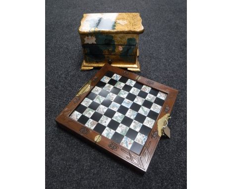 A Japanese folding chess set with pieces, together with a lacquered trinket box