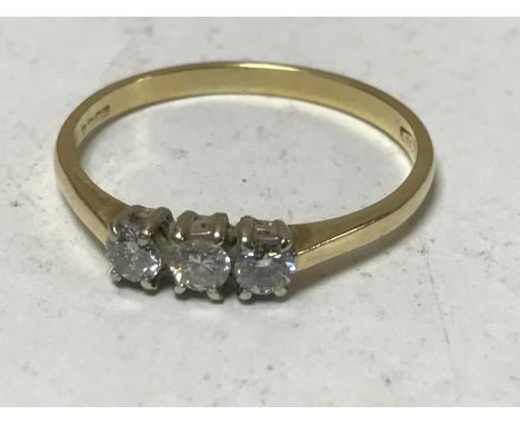 An 18ct gold three stone diamond ring