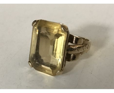 A 9ct gold citrine ring, size P, 6.8g. CONDITION REPORT: The citrine measures approximately 17mm by 13mm with a height of 7mm