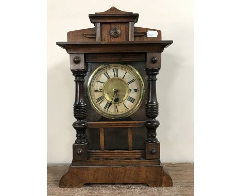 An oak mantel clock 
