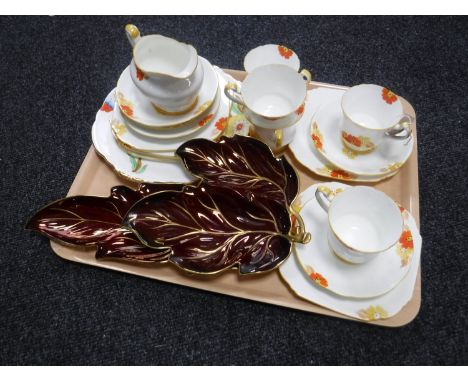 A tray containing two Carlton ware leaf dishes together with nineteen pieces of hand-painted Paragon tea china