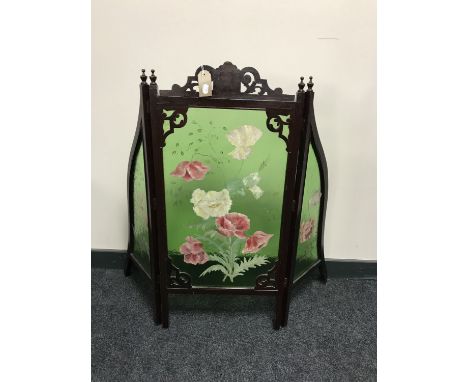A late Victorian mahogany framed three way folding fire screen with hand painted glass panels 