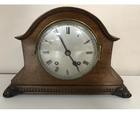 An Edwardian mahogany mantel clock with silvered dial