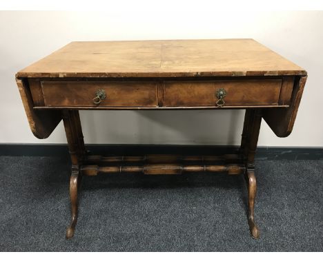 A Victorian walnut sofa table fitted two drawers 