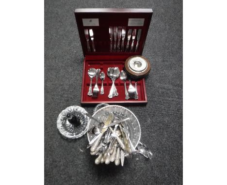 A circular oak barometer together with a part canteen of Viner's cutlery, other cutlery and glass ware