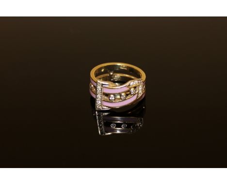 A diamond and enamel buckle ring