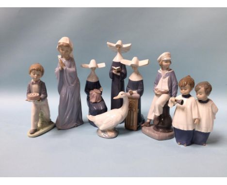 Four Lladro figures and four Nao figures 