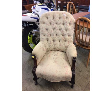 A Victorian mahogany button back scrolled armchair