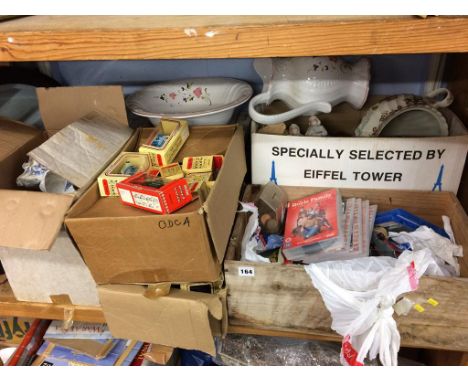 A shelf of china, mirror, Days Gone cars etc.