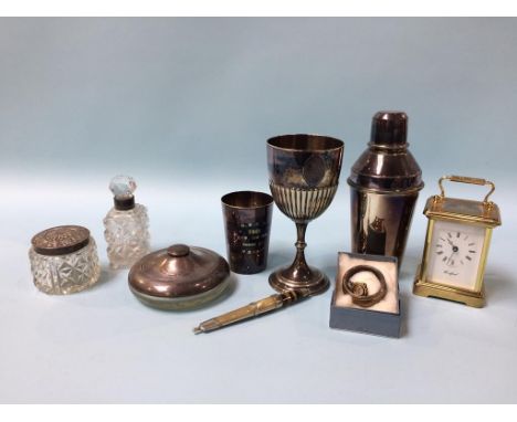 A tray of assorted, to include a modern carriage clock, silver mounted circular powder bowl, silver mounted bottle, silver pl