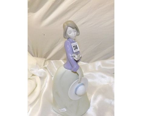 NAO FIGURE OF GIRL HOLDING A BIRD 11 ins TALL EST [£15- £25 ]