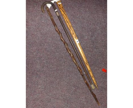 TWO WALKING STICKS & A DECORATIVE ICE PICK AXE EST [£10-£20]