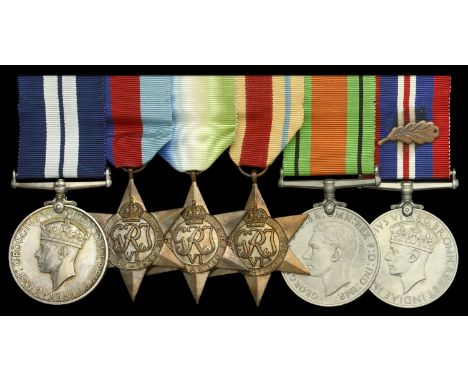 A rare Second War ‘cloak and dagger’ D.S.M. group of six awarded to Leading Telegraphist W. H. Diggins, Royal Navy, for his g