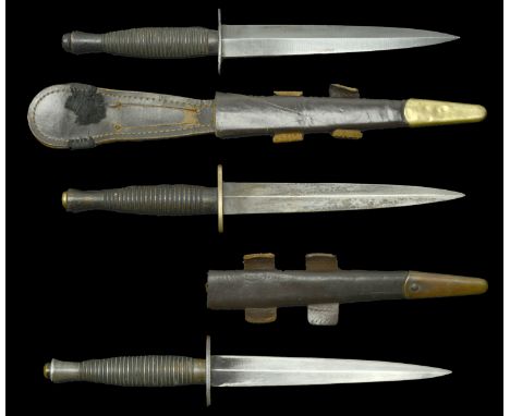 Three Fairbairn Sykes Knives. One Second War period, known amongst collectors as the Middle East model with wood grip, nice b