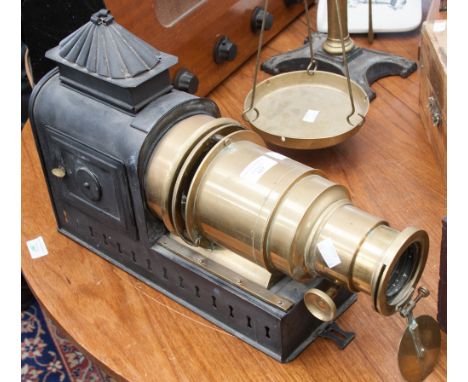 A 19th Century steel lantern projector with lacquered brass tube 