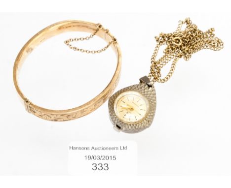 A ladies services pendant watch on a 9 ct fine chain and a 9 ct hollow hinged bangle (2) 