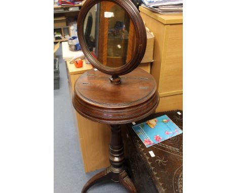 A late Victorian mahogany gentleman's shaving stand, raised on a tripod base