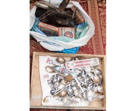 A collection of Commemorative spoons, 1940s glamour calendar and a film projector with Disney reels 